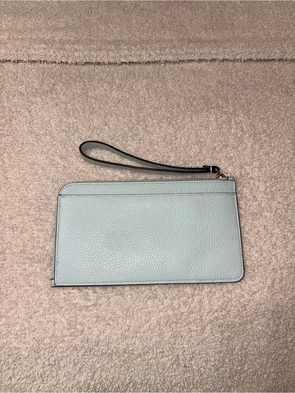 kate spade light blue pebbled leather wristlet phone case